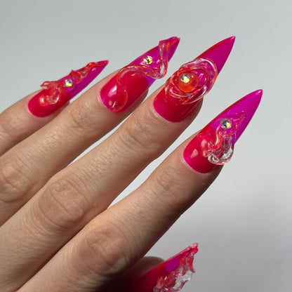 Osez l'originalité avec "Pinky River" : des press-on nails rose néon transparent audacieux, ornés de vagues 3D et de strass Swarovski. Un design unique, éclatant et sophistiqué pour des ongles qui font sensation !